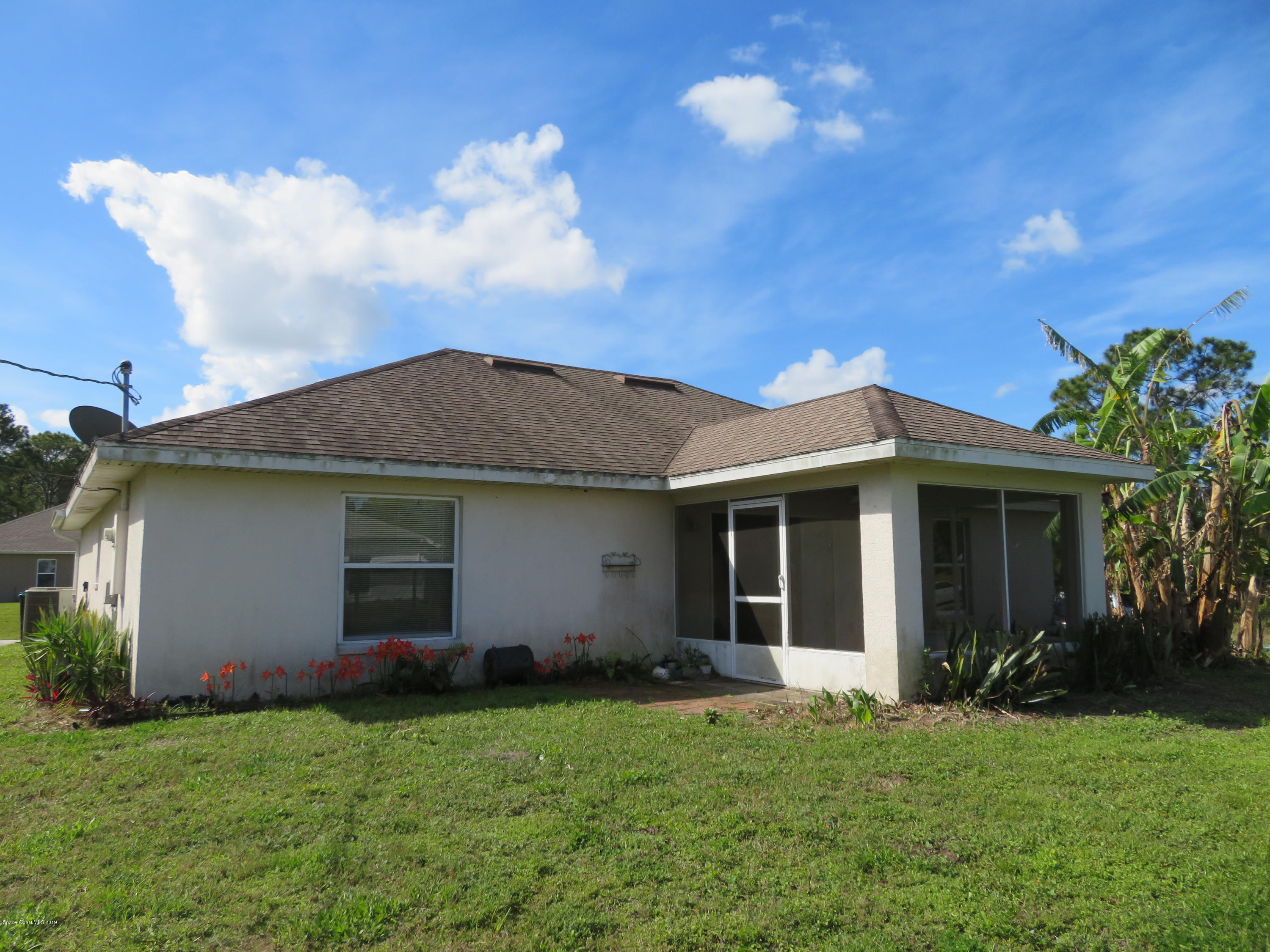801 Clifton Road Southeast Palm Bay, FL 32909 - Photo 25 of 25 a view of an house with backyard space and garden