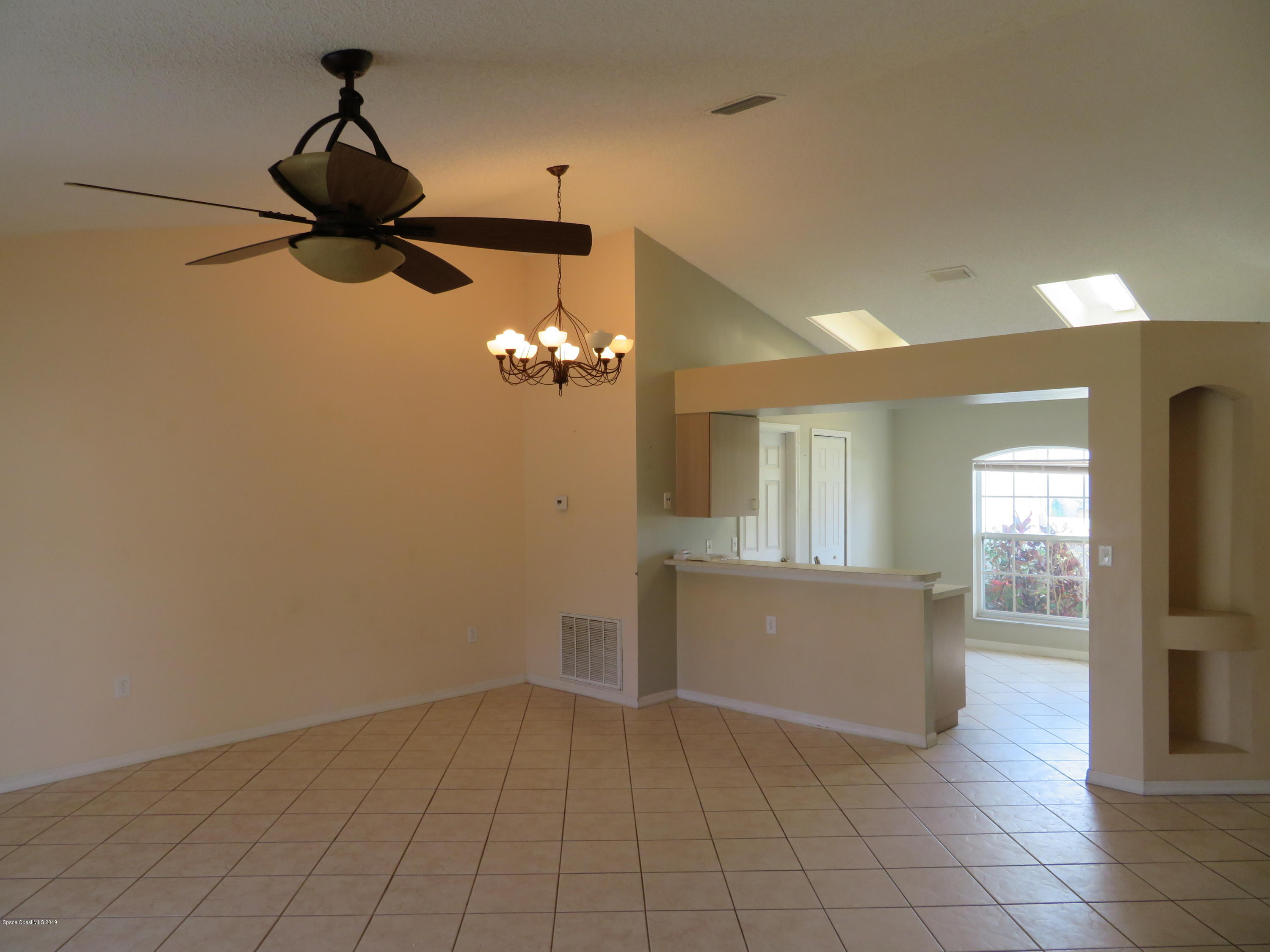 801 Clifton Road Southeast Palm Bay, FL 32909 - Photo 4 of 25 a view of empty room with wooden floor