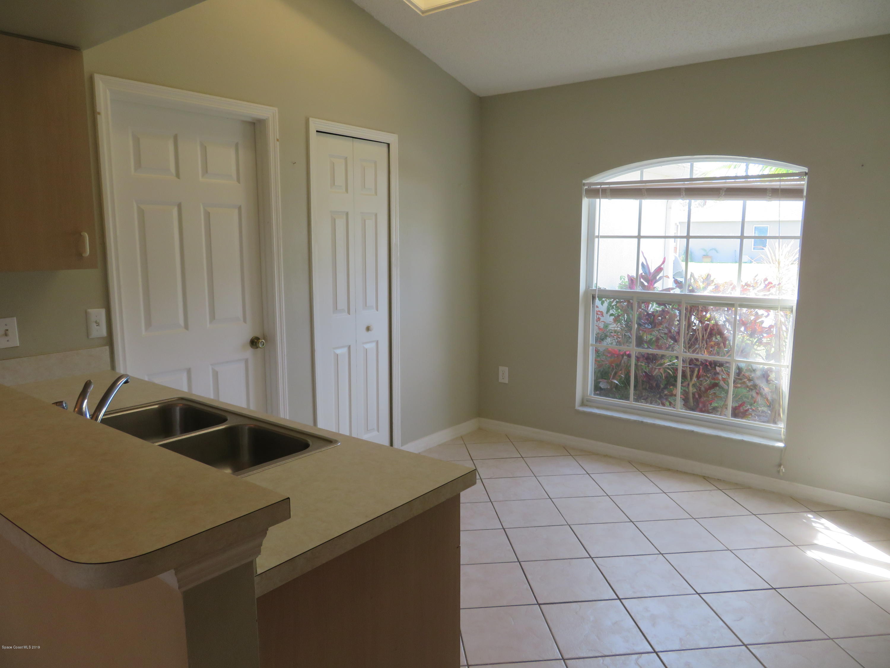 801 Clifton Road Southeast Palm Bay, FL 32909 - Photo 7 of 25 a view of an empty room and window
