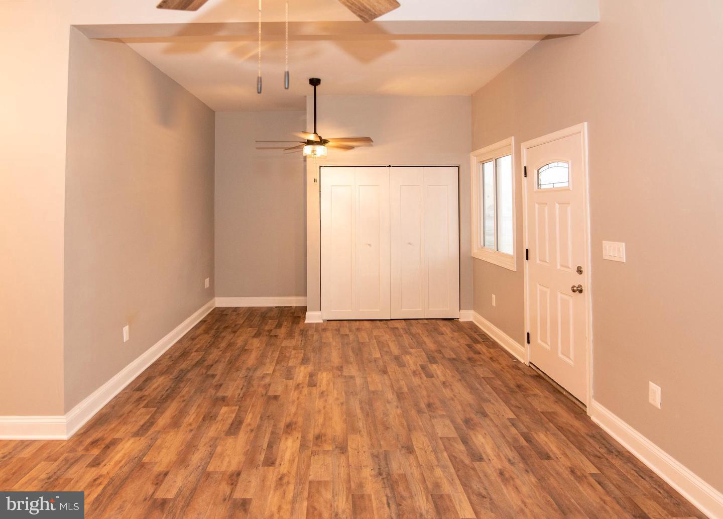 913 Wise Avenue Baltimore, MD 21222 - Photo 9 of 11 a view of an empty room with wooden floor