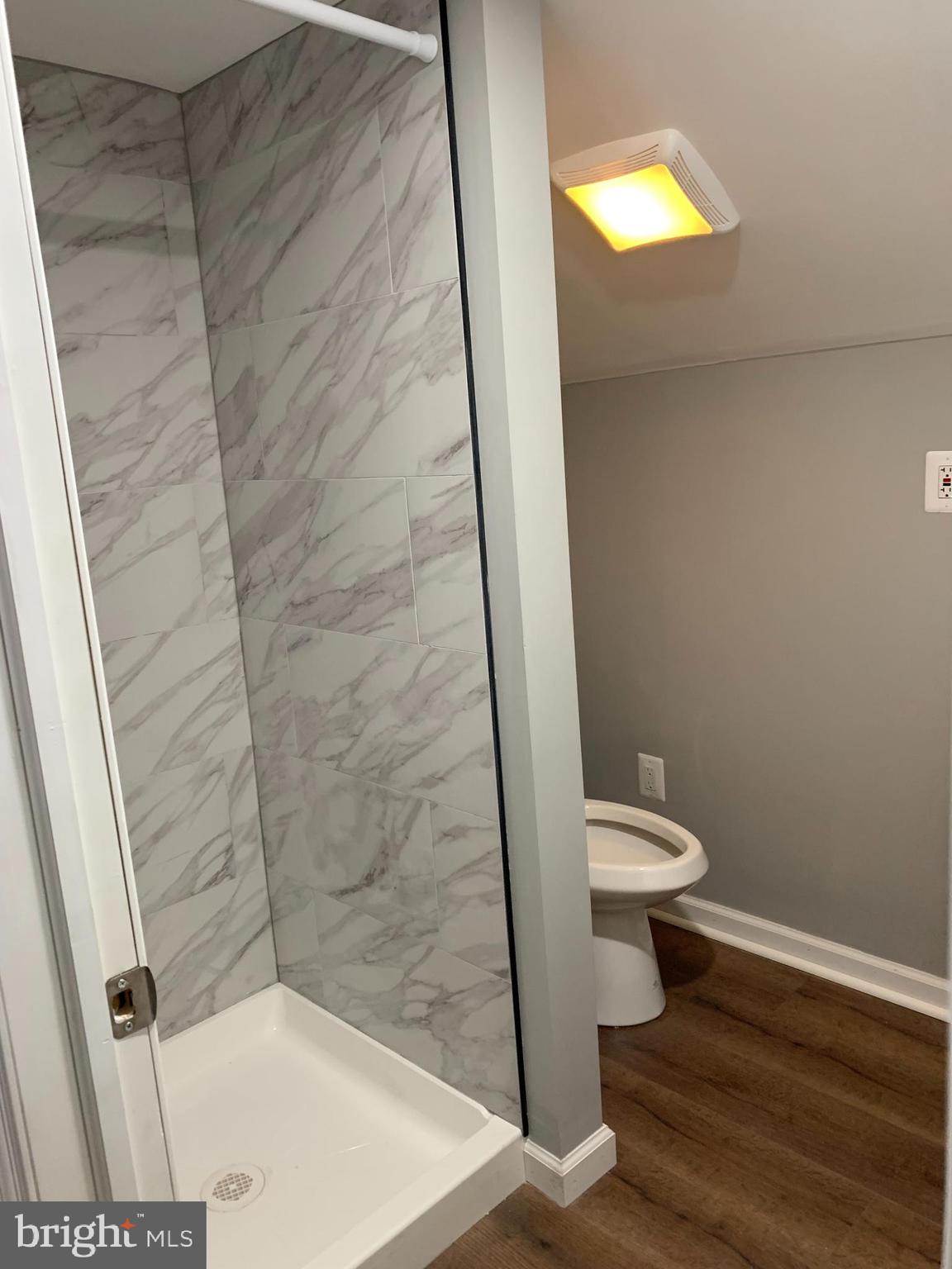 913 Wise Avenue Baltimore, MD 21222 - Photo 10 of 11 a bathroom with a toilet and a shower