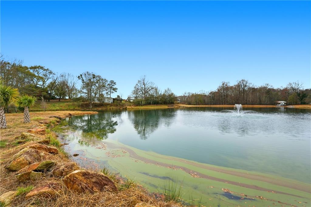 1188 Carl-Bethlehem Road Winder, GA 30680 - Photo 17 of 31 a view of a lake with houses in the background