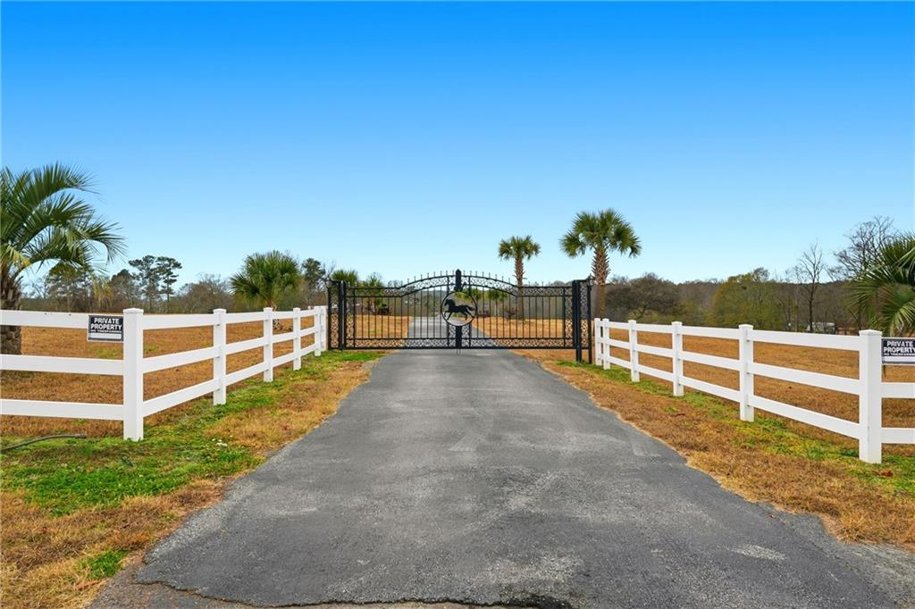 1188 Carl-Bethlehem Road Winder, GA 30680 - Photo 19 of 31 a view of a yard with wooden fence
