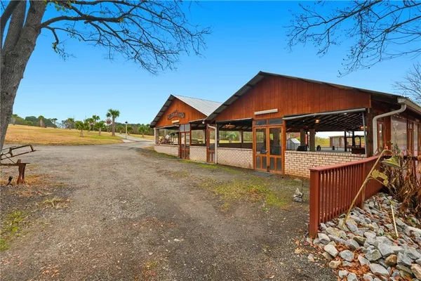a view of a house with backyard and ocean view