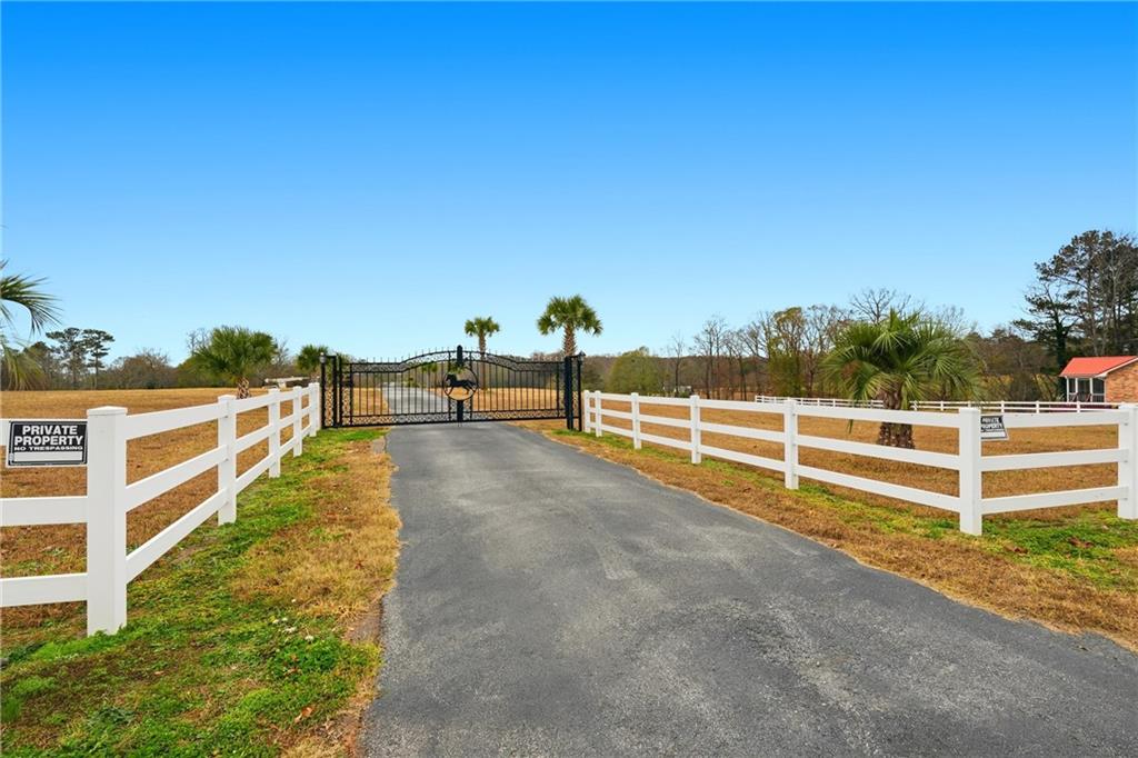 1188 Carl-Bethlehem Road Winder, GA 30680 - Photo 2 of 31 a view of a yard with wooden fence