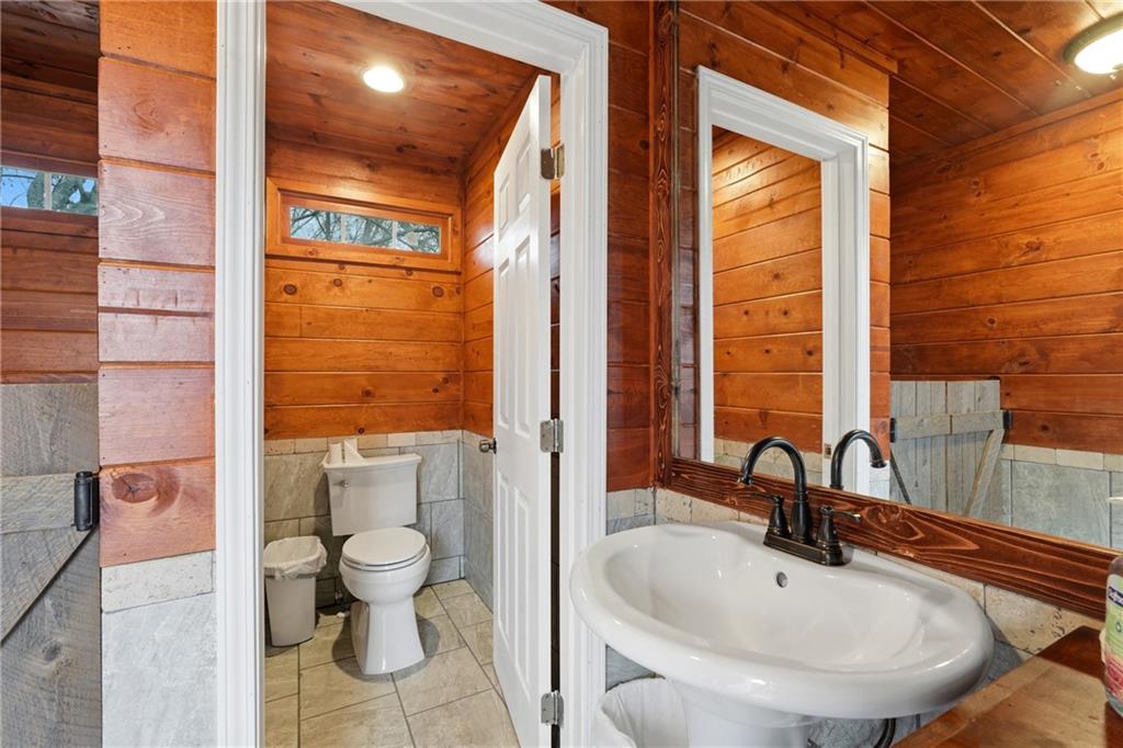 1188 Carl-Bethlehem Road Winder, GA 30680 - Photo 22 of 31 a bathroom with a sink and a mirror