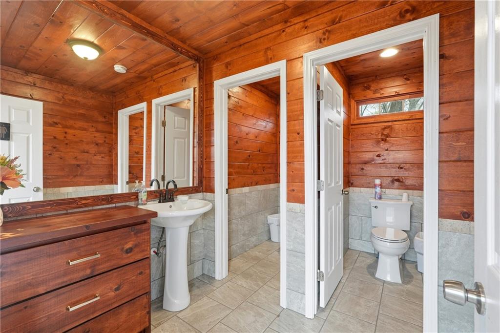 1188 Carl-Bethlehem Road Winder, GA 30680 - Photo 23 of 31 a bathroom with a sink a toilet and shower