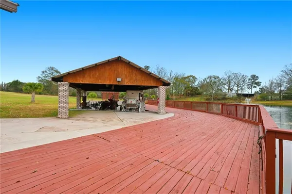 a view of a swimming pool with a patio