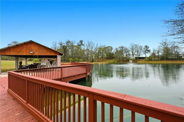 a view of a lake with a iron bridge
