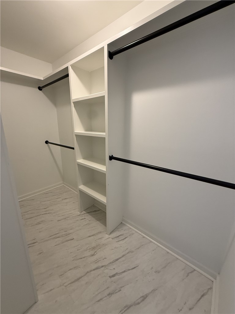 311 Dixie Drive Seneca, SC 29672 - Photo 5 of 8 This spacious closet features ample storage and modern flooring.