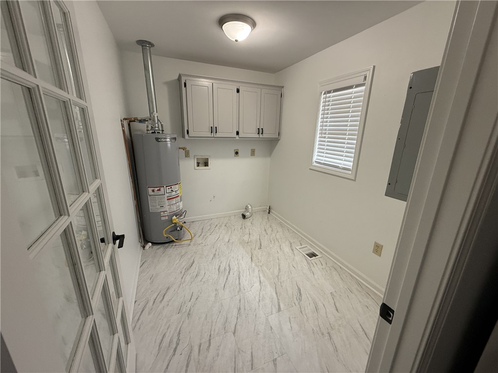 311 Dixie Drive Seneca, SC 29672 - Photo 6 of 8 Functional utility room with ample space for daily tasks.