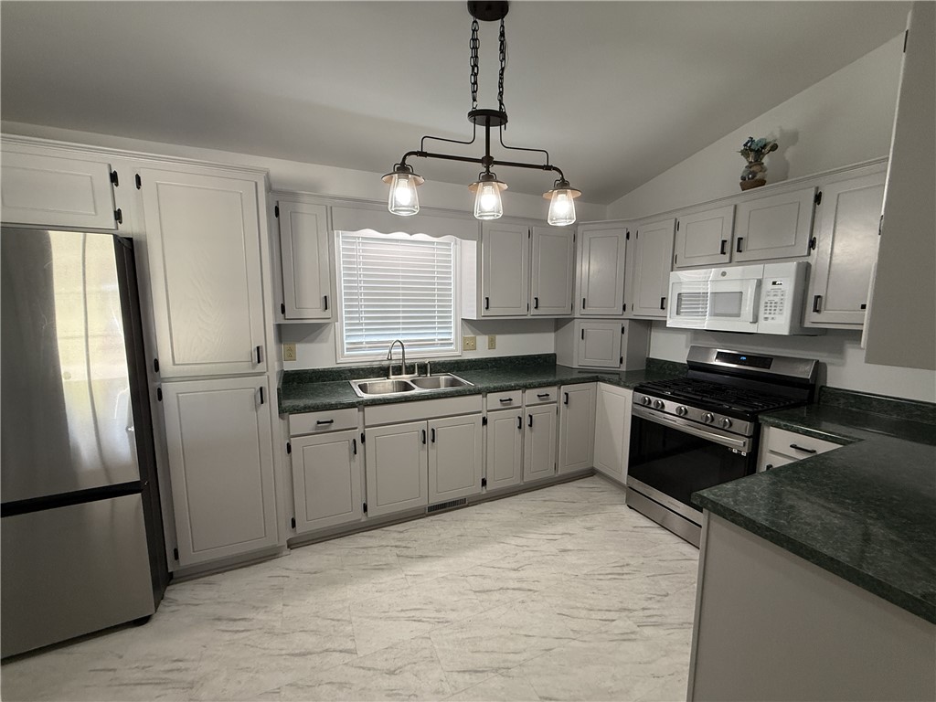 311 Dixie Drive Seneca, SC 29672 - Photo 8 of 8 This spacious kitchen offers ample cabinet storage and a bright, functional layout for everyday living.