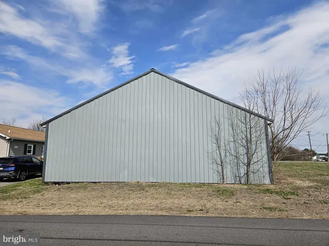 a view of backyard with large trees