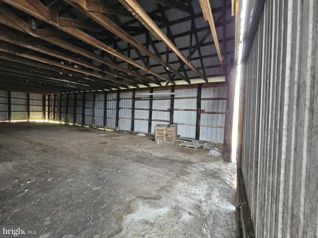 a view of a empty room with a garage