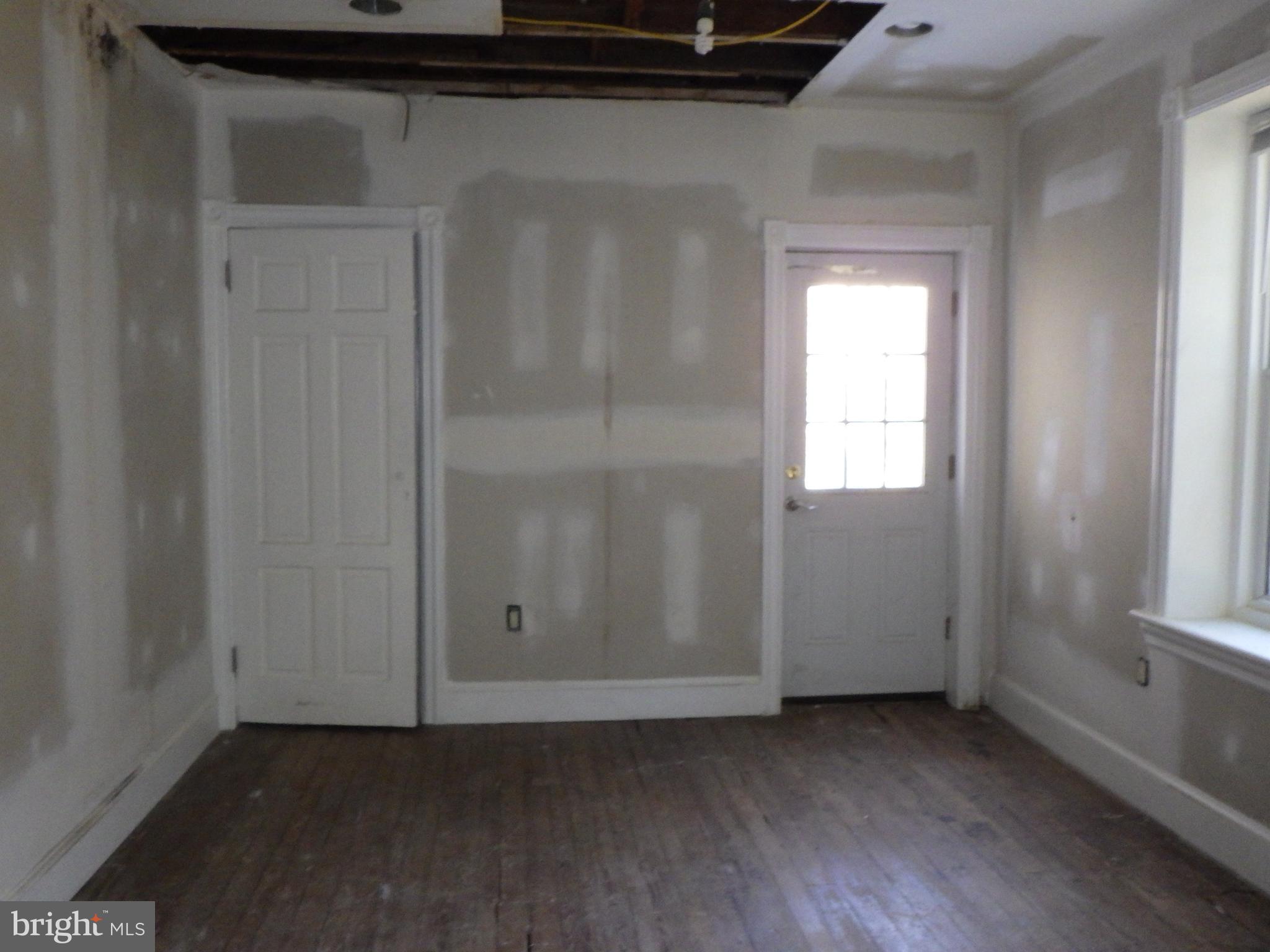 260 Harvey Street Philadelphia, PA 19144 - Photo 14 of 25 a view of an empty room with wooden floor and a window