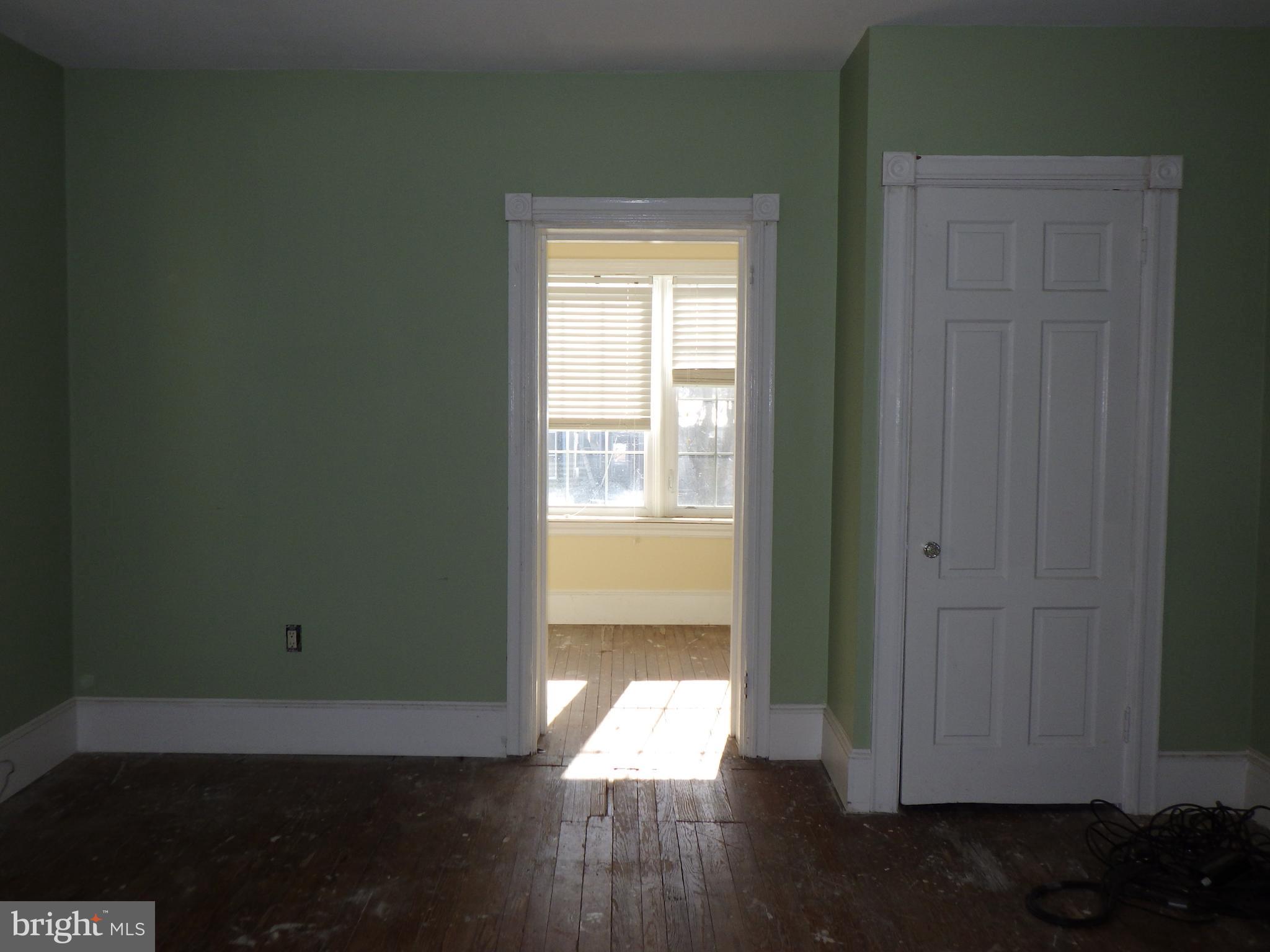 260 Harvey Street Philadelphia, PA 19144 - Photo 16 of 25 a view of empty room with wooden floor and fan