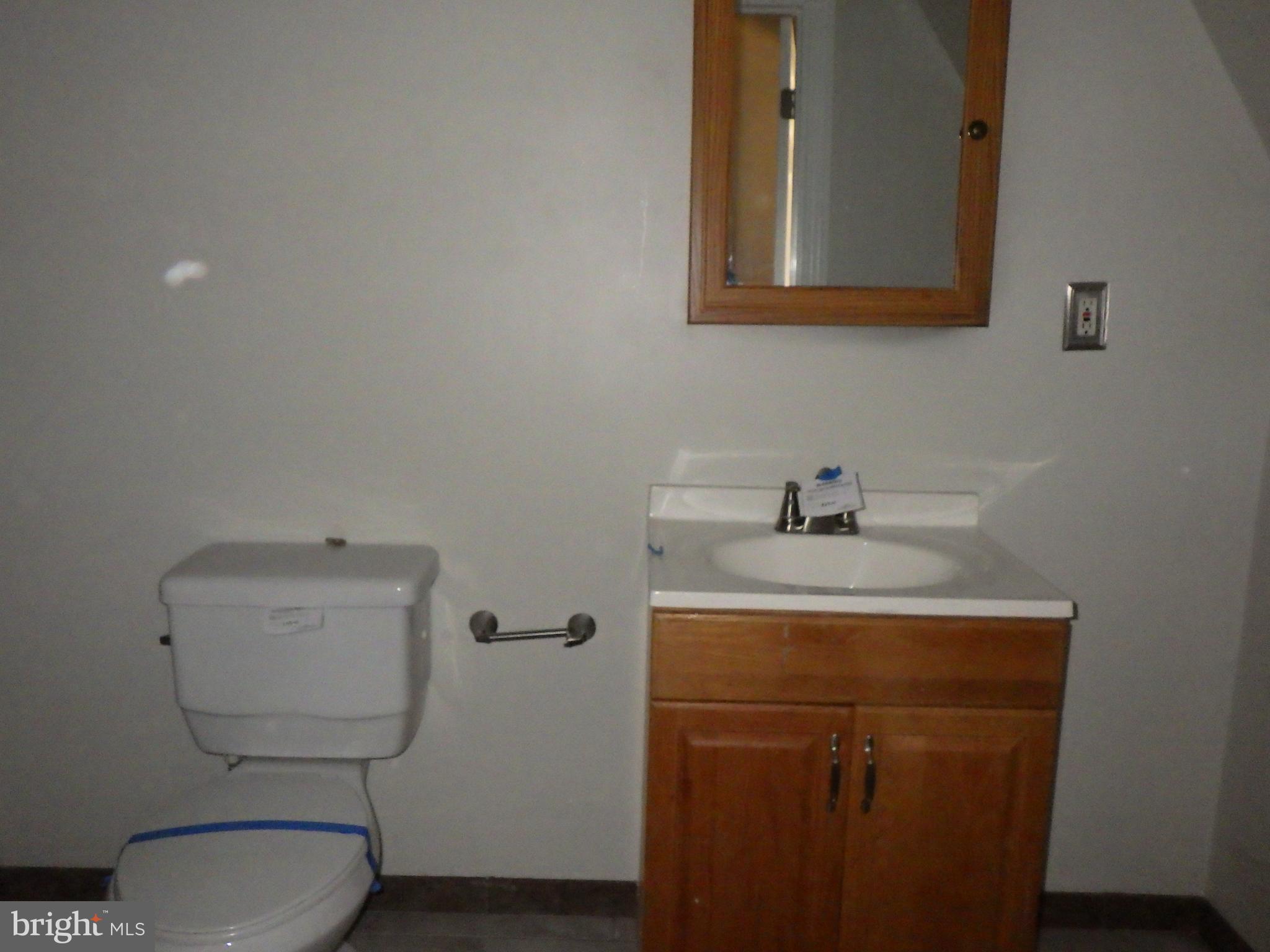 260 Harvey Street Philadelphia, PA 19144 - Photo 20 of 25 a bathroom with a toilet sink and mirror