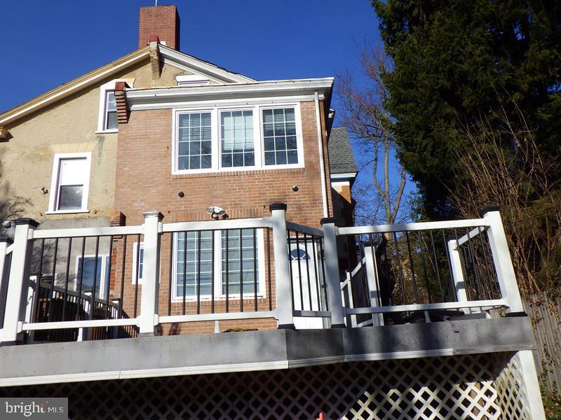 260 Harvey Street Philadelphia, PA 19144 - Photo 2 of 25 a view of roof deck with couches wooden floor and fence