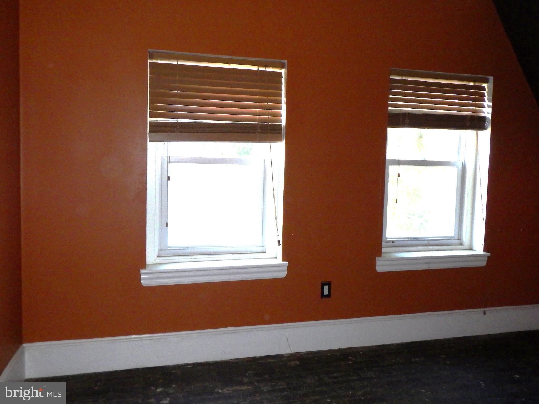 260 Harvey Street Philadelphia, PA 19144 - Photo 23 of 25 a view of an empty room with wooden floor and a window