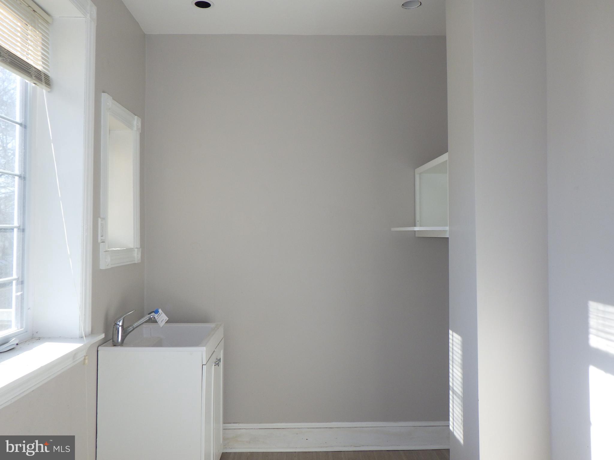 260 Harvey Street Philadelphia, PA 19144 - Photo 25 of 25 a bathroom with a sink and vanity