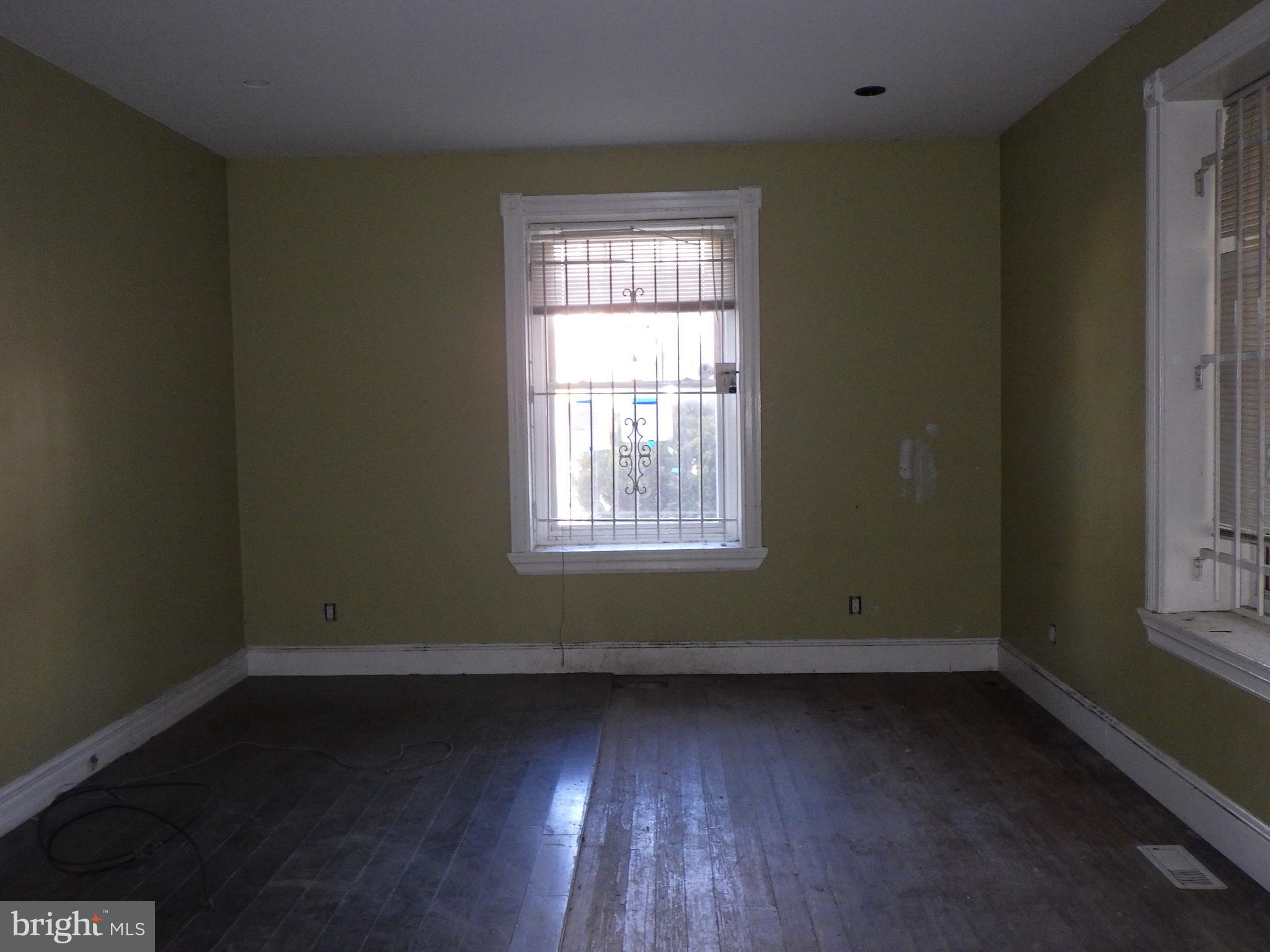 260 Harvey Street Philadelphia, PA 19144 - Photo 6 of 25 an empty room with wooden floor and windows