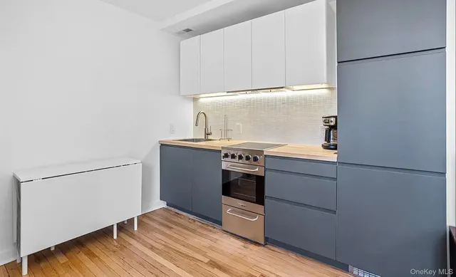a view of a dining area with furniture and wooden floor