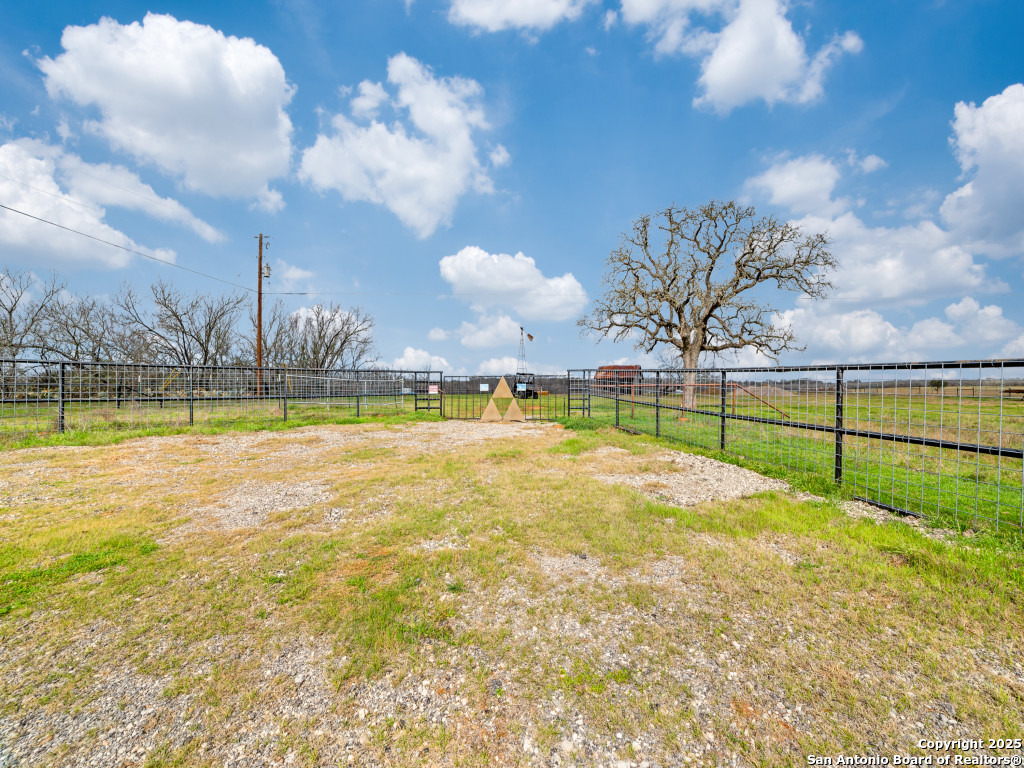1000 Mill Creek Road Seguin, TX 78155 - Photo 4 of 15 a view of a swimming pool with an outdoor space and seating area