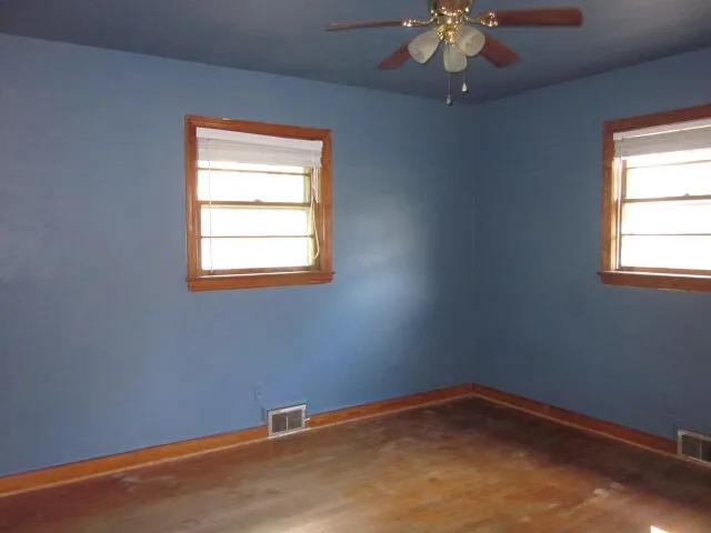 an empty room with windows