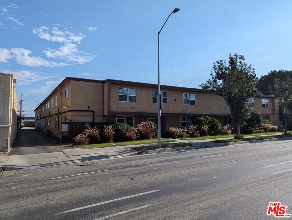 9815 Imperial Highway, Unit 40 Downey, CA 90242 - Photo 16 of 20 a street sign on a sidewalk next to a road