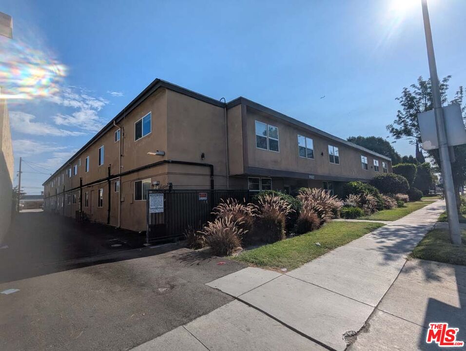 9815 Imperial Highway, Unit 40 Downey, CA 90242 - Photo 17 of 20 a front view of a house with garden