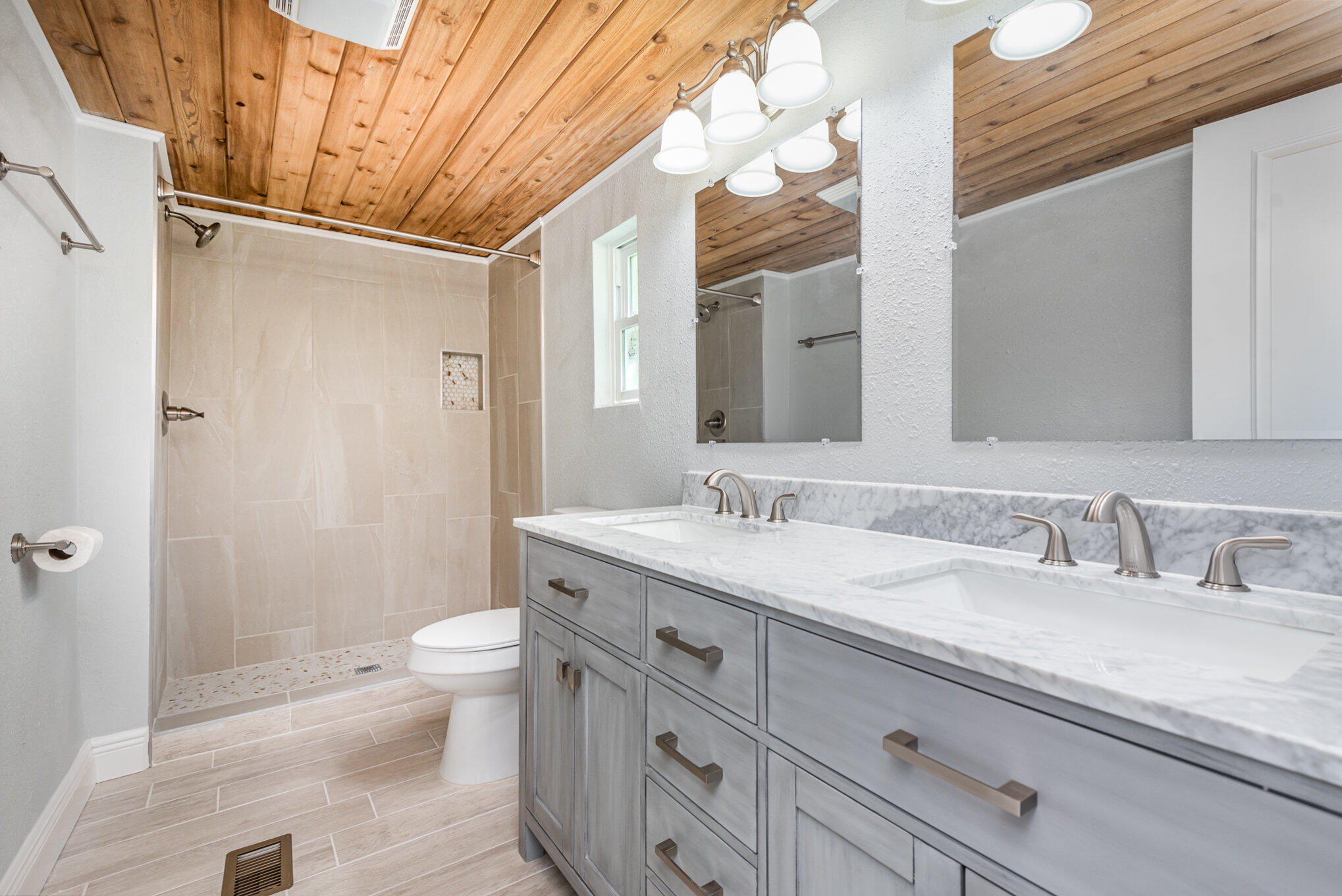 24050 Bass Road Astor, FL 32102 - Photo 11 of 22 a bathroom with a granite countertop sink toilet and shower