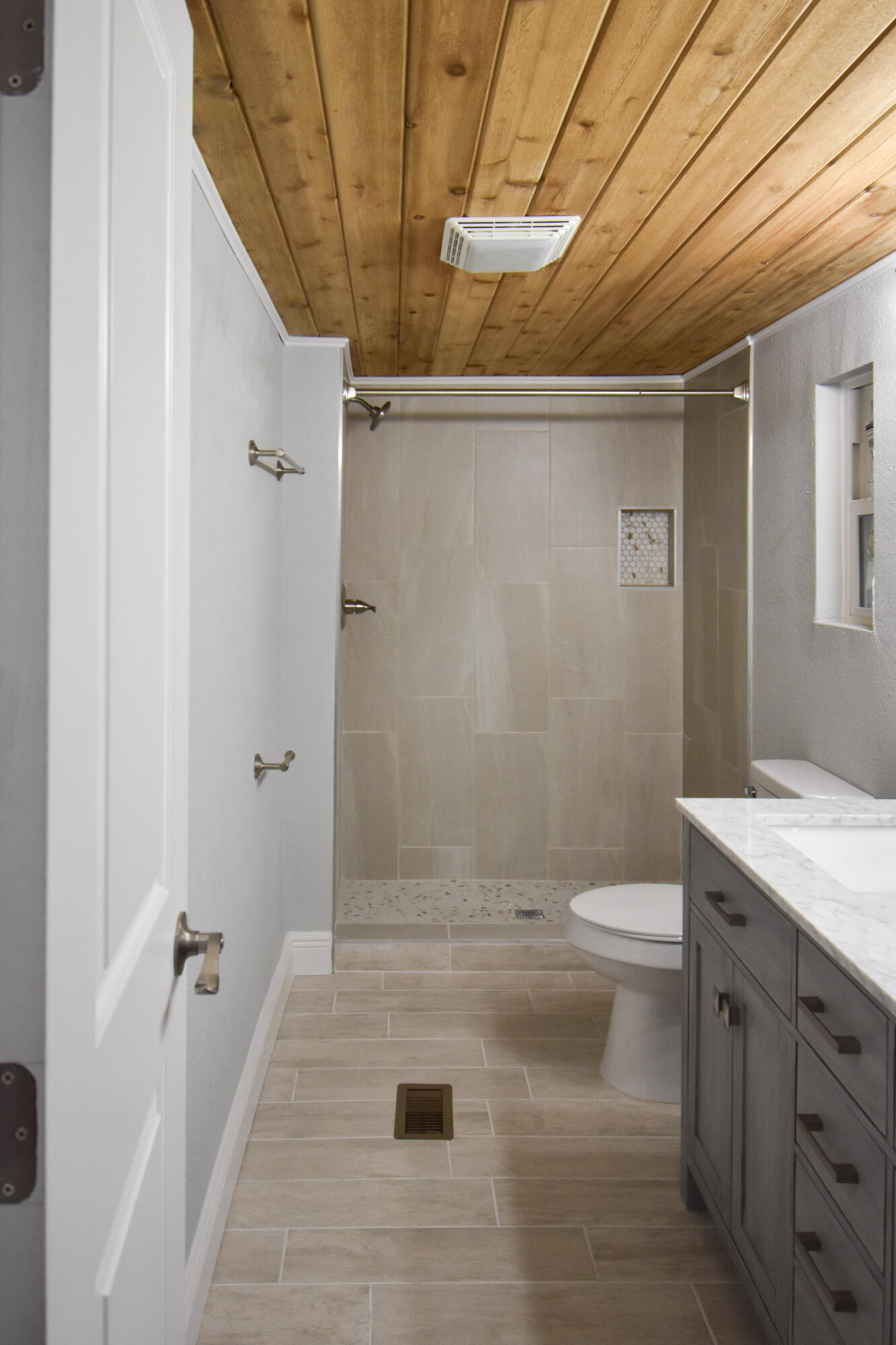 24050 Bass Road Astor, FL 32102 - Photo 12 of 22 a bathroom with a sink a toilet and shower