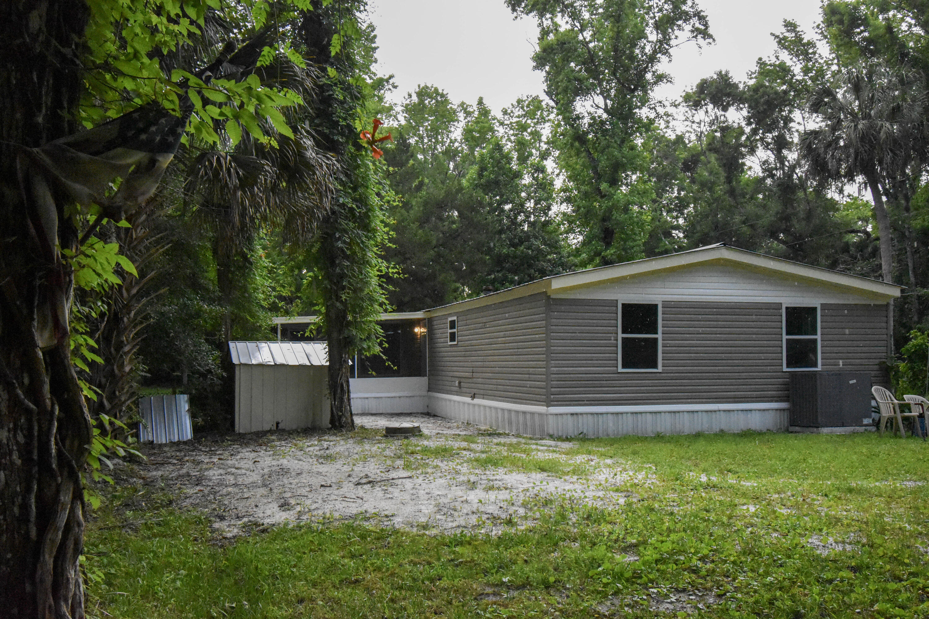 24050 Bass Road Astor, FL 32102 - Photo 19 of 22 a backyard of a house with lots of green space
