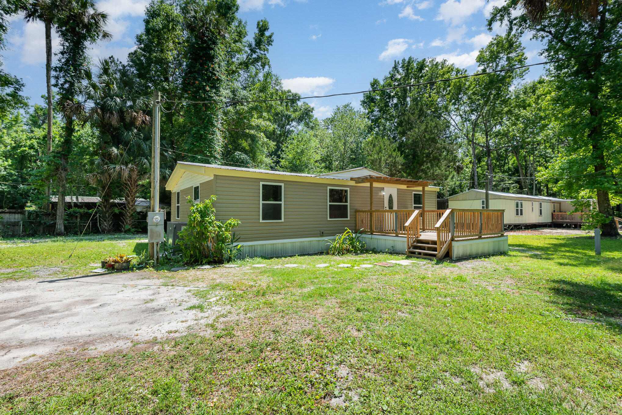 24050 Bass Road Astor, FL 32102 - Photo 20 of 22 a view of a house with backyard and sitting area
