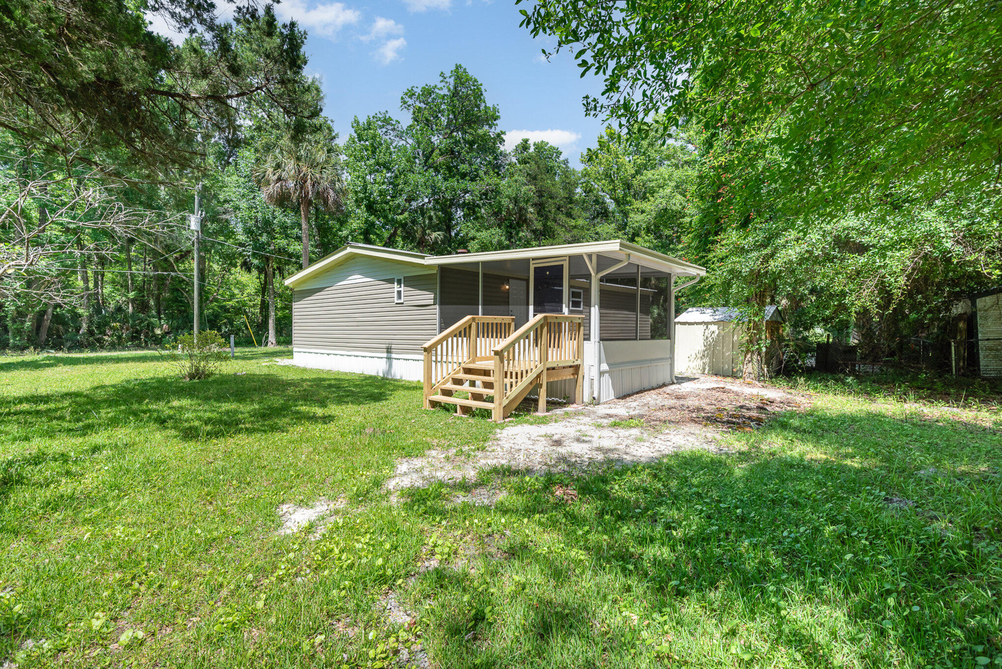 24050 Bass Road Astor, FL 32102 - Photo 21 of 22 a view of a house with backyard