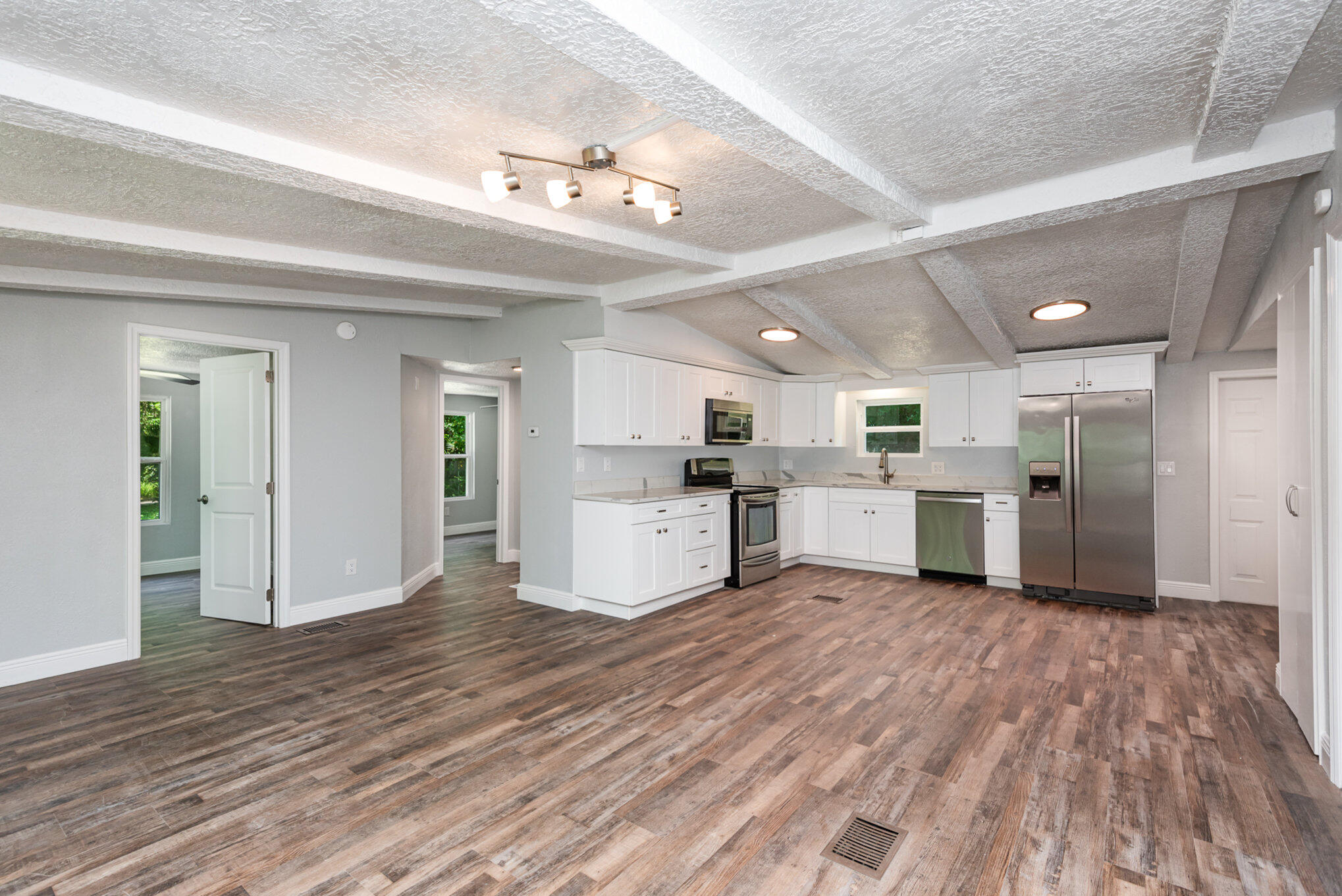 24050 Bass Road Astor, FL 32102 - Photo 4 of 22 a view of a kitchen with microwave and cabinets