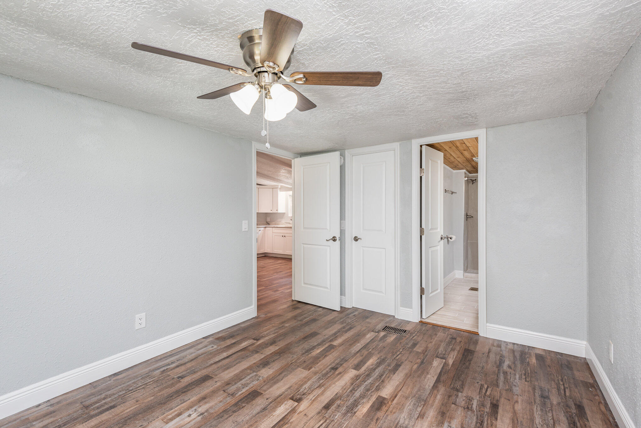 24050 Bass Road Astor, FL 32102 - Photo 10 of 22 a view of an empty room and wooden floor