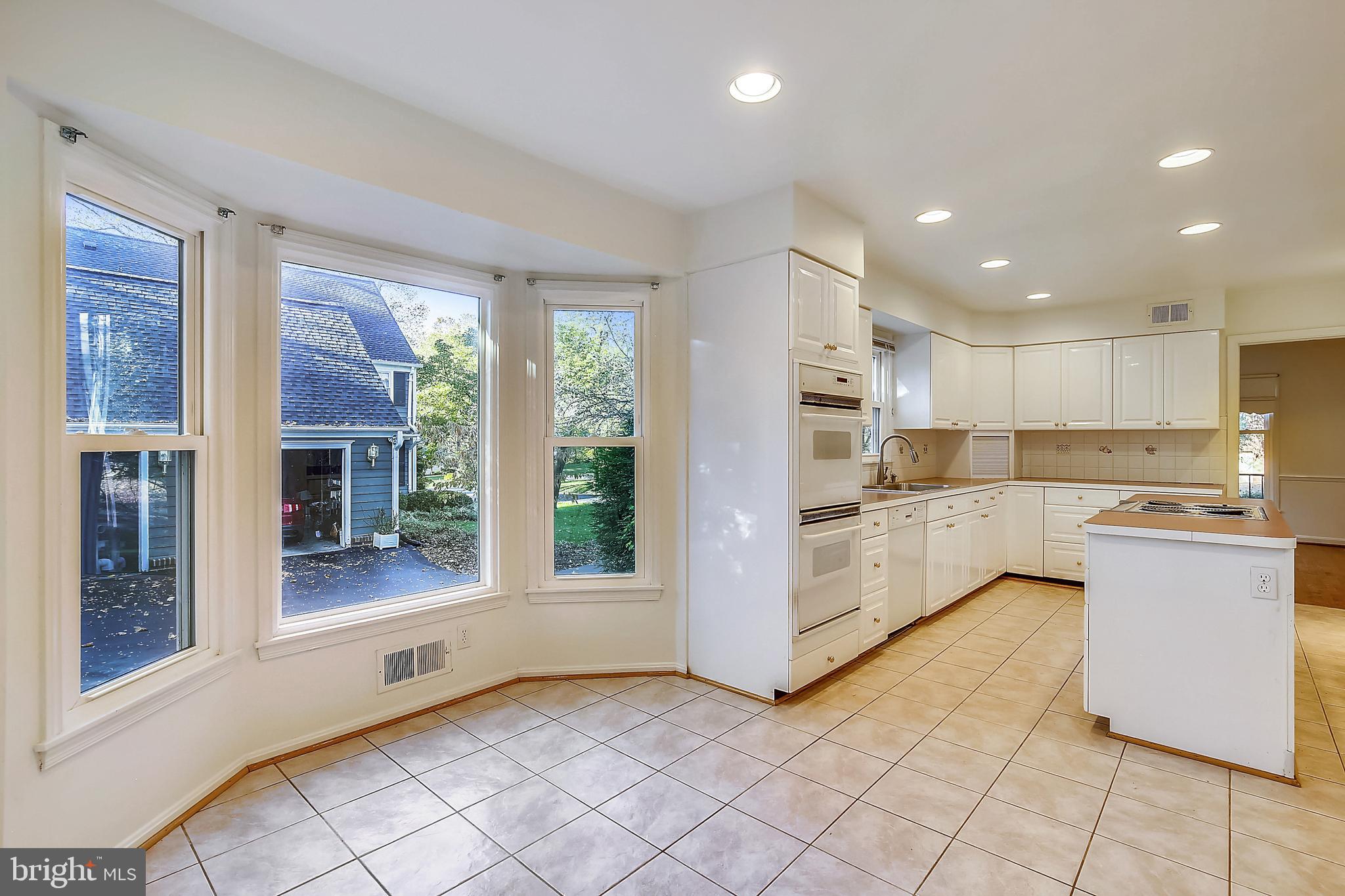 9320 Winterset Drive Potomac, MD 20854 - Photo 17 of 70 Table space in Kitchen surrounded by windows
