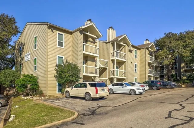 a view of a parked cars in front of a building
