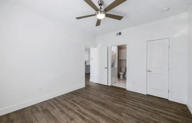 a close view of a sink and a utility room with dryer and washer