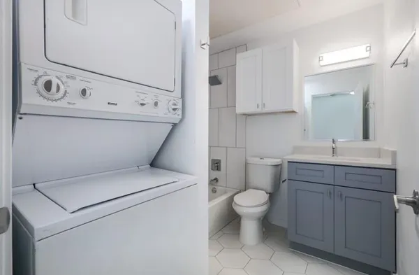 a bathroom with a toilet a sink and a bathtub