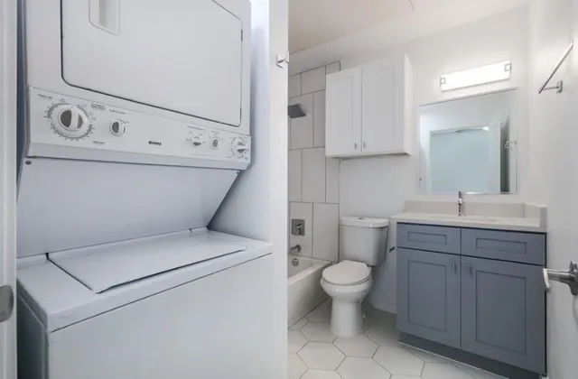 a bathroom with a toilet a sink and a bathtub