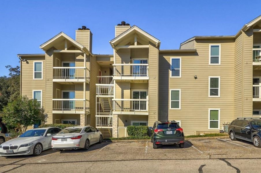114 East 31st Street, Unit 314 Austin, TX 78705 - Photo 2 of 20 a front view of a residential apartment building with a yard