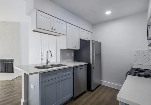 a kitchen with a stove and a microwave