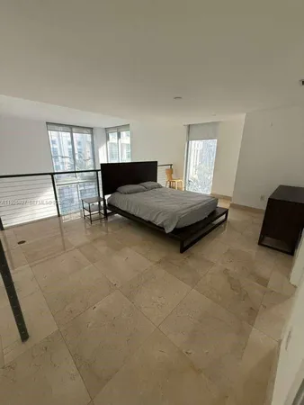 a living room with furniture and window