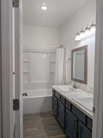 a view of a house with a yard and a garden