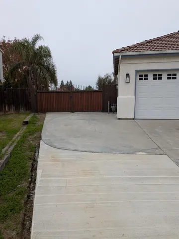 a white house with a yard and a yard