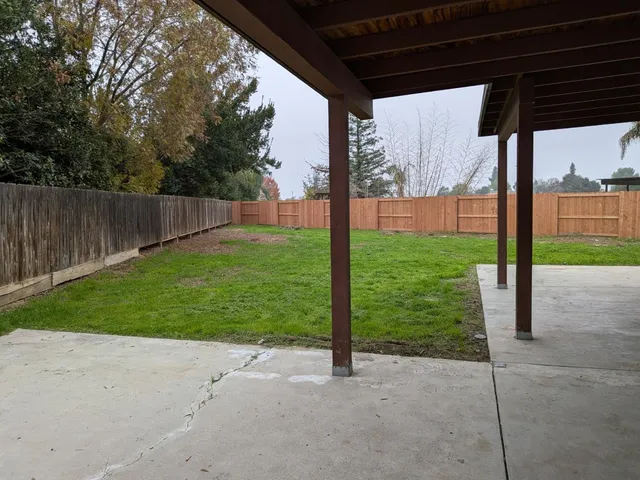 a view of an empty room with palm trees
