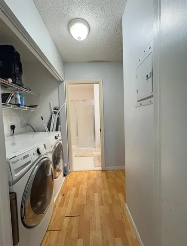 a view of a storage & utility room with washer and dryer