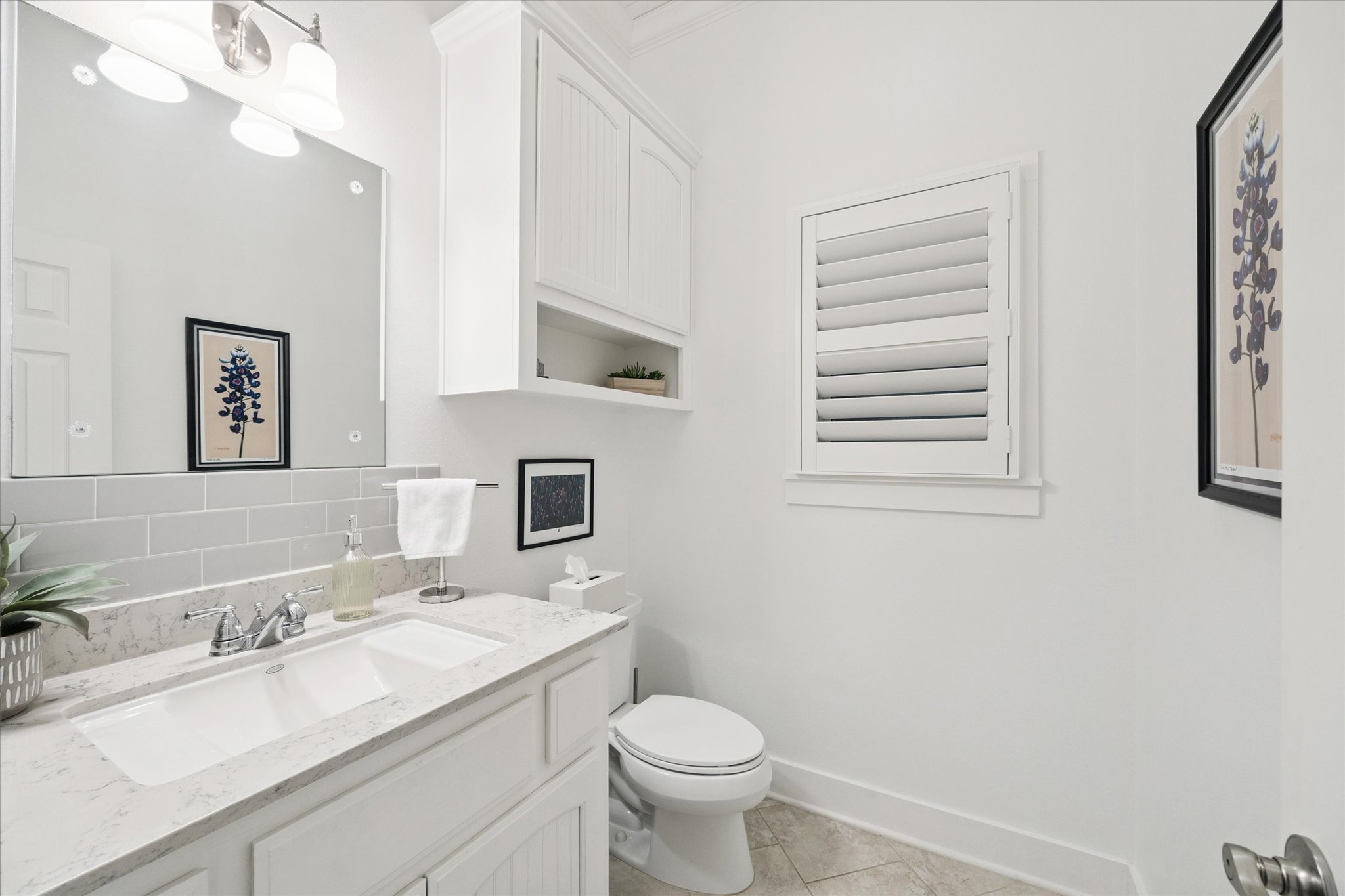 5100 Jaeger Road Burton, TX 77835 - Photo 21 of 34 Bathroom featuring vanity, light tile patterned floors, and tasteful backsplash